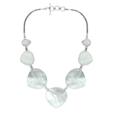 Women’s sterling silver necklace with heart-shape Mother of Pearl stones and Bali-inspired accents.